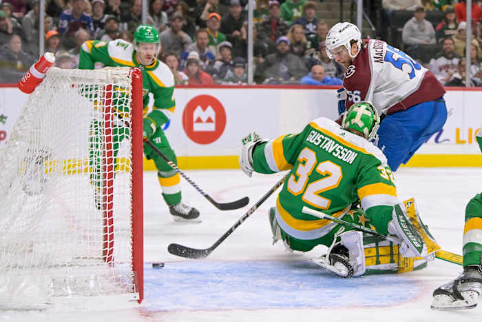 Nov 24, 2023; Saint Paul, Minnesota, USA; Colorado Avalanche defenseman Kurtis MacDermid (56) beats Minnesota Wild goalie Filip Gustavsson (32) for a goal during the third period at Xcel Energy Center.